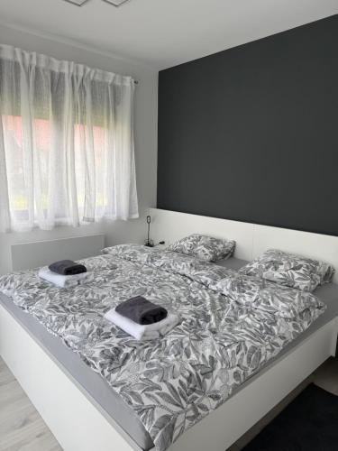 a bed with two pillows on it in a bedroom at Kuća za odmor Stubaki in Stubicke Toplice
