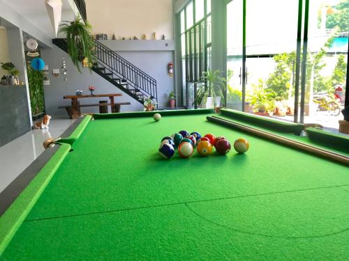 a pool table with balls on it in a room at WAKE UP @Lanta Hotel : Cafe in Ko Lanta