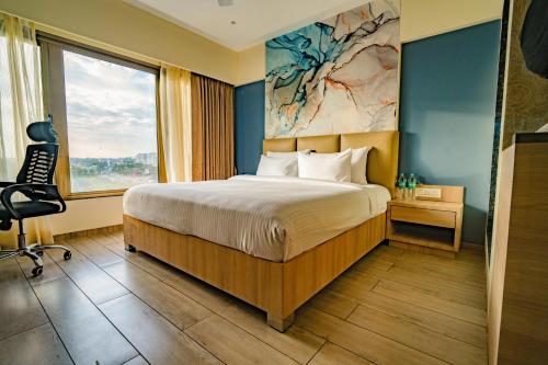 Postel nebo postele na pokoji v ubytování Pride Elite Chhatrapati Sambhaji Nagar