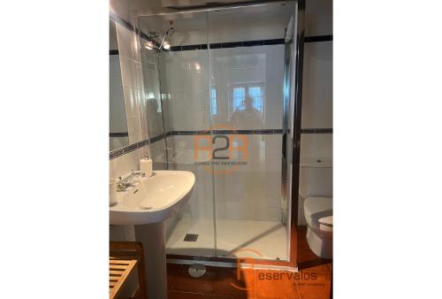 a bathroom with a shower and a sink at 15A08 El Rosal By R2R in Buelna