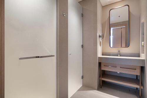 a bathroom with a sink and a mirror at Vida Dubai Mall! 2 Bedroom with Burj Khalifa View! Direct Access to Dubai Mall in Dubai