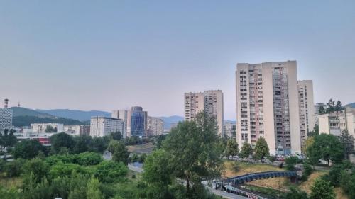 a city with tall buildings in the background at Apartman IsTar View in Sarajevo