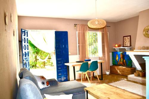 a living room with a couch and a table at La casita del oso in Linares de la Sierra