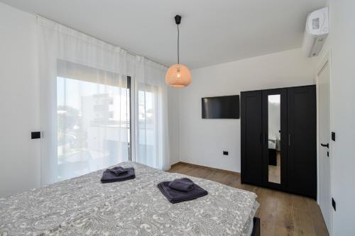 Postel nebo postele na pokoji v ubytování Villa EnDi in Medulin, Istria by Istrabook