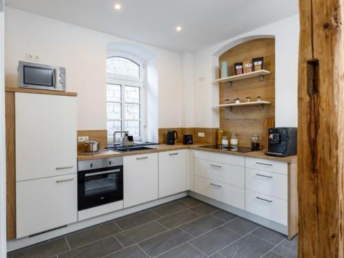 Η κουζίνα ή μικρή κουζίνα στο Ferienwohnung Alte Schule Kennfus - Ruhe genießen