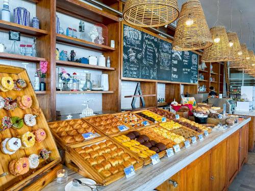 a bakery with a display of pastries and other foods at Montigo Resorts Nongsa in Nongsa