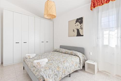 Ένα ή περισσότερα κρεβάτια σε δωμάτιο στο Casa Cossu