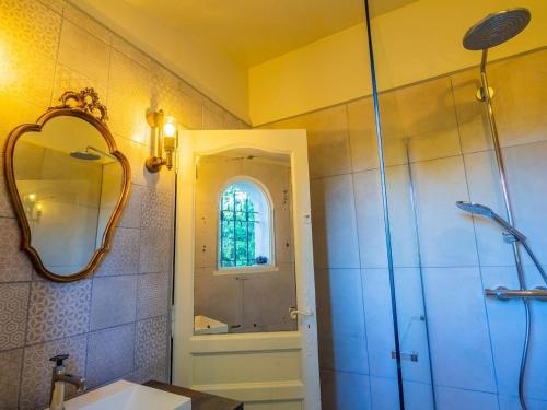 a bathroom with a shower and a sink and a mirror at 3 Bedroom 2 Bath Villa Private Pool in Mougins in Mougins