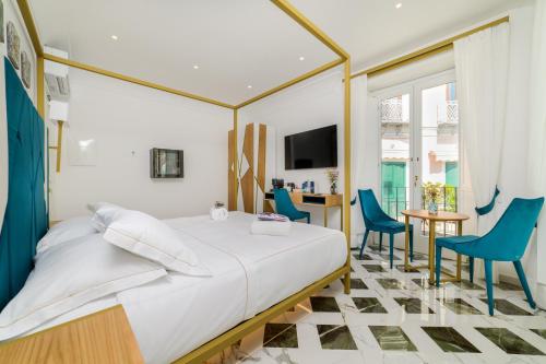 Ένα ή περισσότερα κρεβάτια σε δωμάτιο στο Palazzo Vitagliano