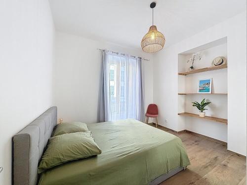 Ένα ή περισσότερα κρεβάτια σε δωμάτιο στο Le Francis - Riquier Port de Nice