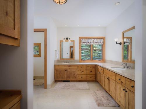 a bathroom with a sink and a mirror at RMR: Granite Ridge Lodge 3217 in Teton Village in Teton Village