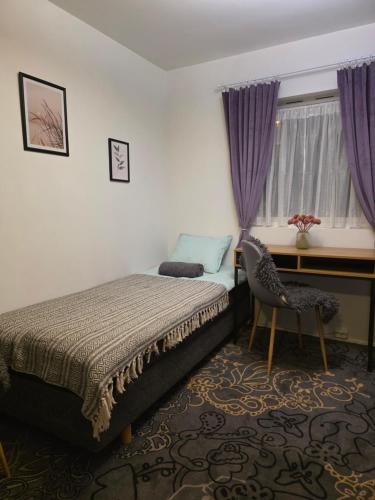 Ένα ή περισσότερα κρεβάτια σε δωμάτιο στο Nord Stay Tromso