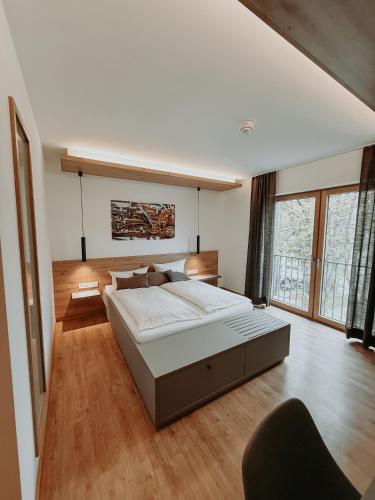 a large bedroom with a large bed in a room at Kolping-Hotel in Schweinfurt