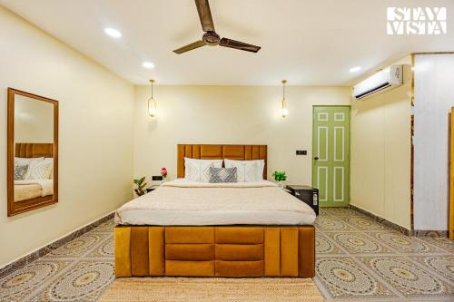 Ένα ή περισσότερα κρεβάτια σε δωμάτιο στο The Green Post by VEO - Part of StayVista