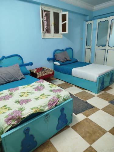 Ένα ή περισσότερα κρεβάτια σε δωμάτιο στο Luna Nile