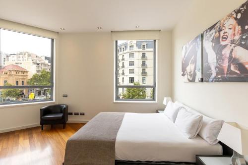 Ένα ή περισσότερα κρεβάτια σε δωμάτιο στο Uma Suites Passeig de Gracia 16