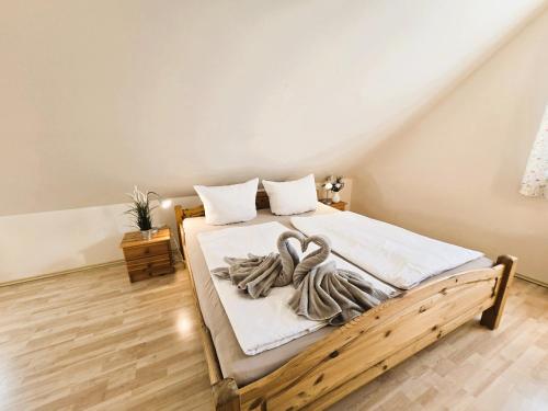 a bedroom with a bed with two swans on it at FH Butt in Blengow