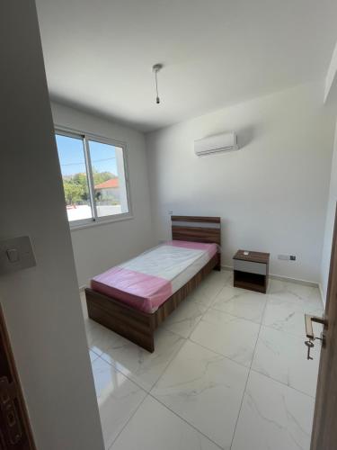 Ένα ή περισσότερα κρεβάτια σε δωμάτιο στο Eleftheriou Court