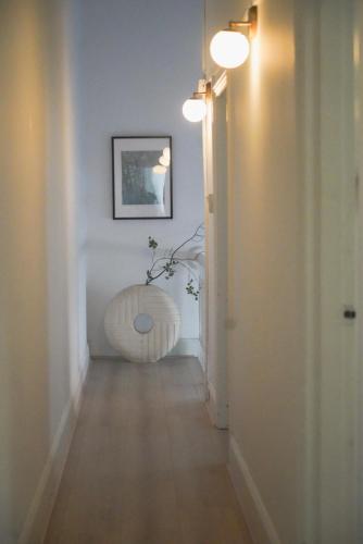a hallway with a table in the middle of a room at Your home on Smith St Collingwood Melbourne with parking in Melbourne