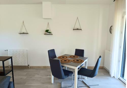 a dining room with a table with donuts on it at Appartement avec vue exceptionnelle in Blanzat