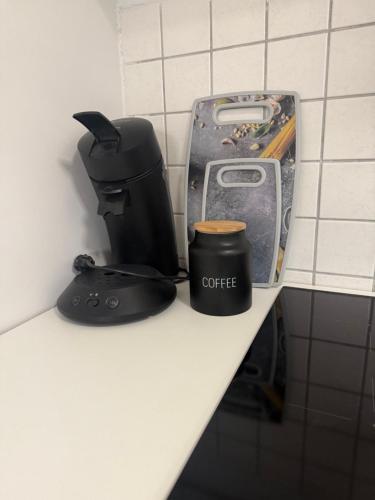 a coffee maker and a cup on a counter at Cozy Room - Self Check In - Bad Nauheim in Bad Nauheim