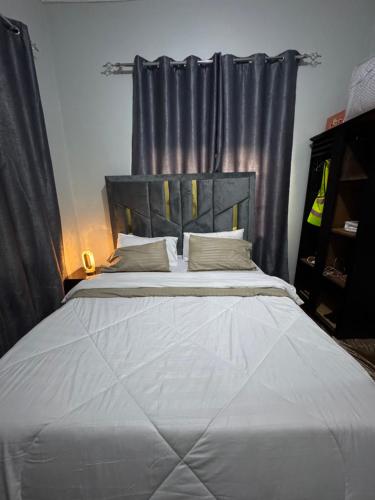 Ένα ή περισσότερα κρεβάτια σε δωμάτιο στο Q Homes Platinum Suite