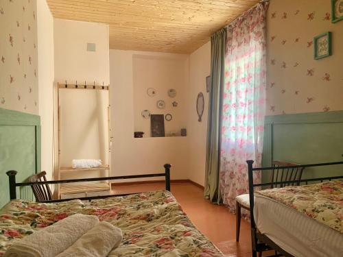 Ένα ή περισσότερα κρεβάτια σε δωμάτιο στο Vintage house Lantia