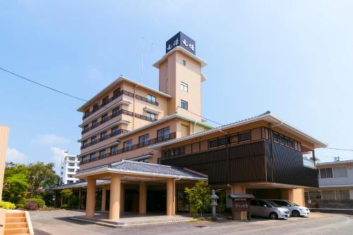 a building with a clock tower on top of it at Ureshino Motoyu in Ureshino