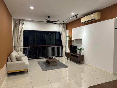 a living room with a couch and a ceiling fan at The Jelutong Trio, Spacious 3-Bedroom Luxury Stay in Shah Alam