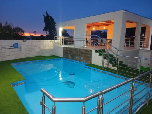 a swimming pool in the backyard of a house at Kliprivier Accommodation in Johannesburg
