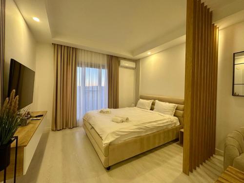 Ένα ή περισσότερα κρεβάτια σε δωμάτιο στο Orion Studio #cosmopolis