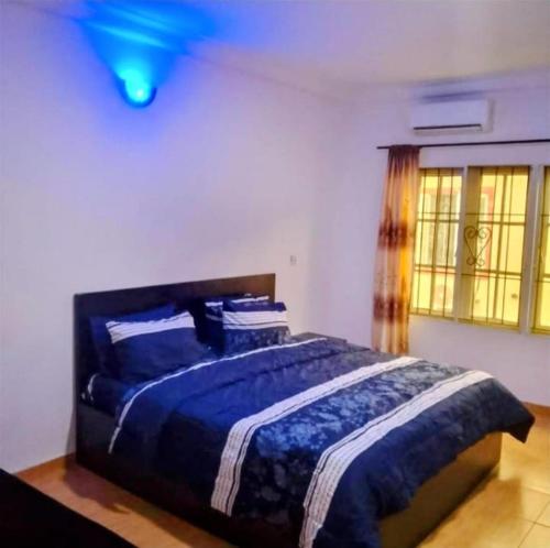 Ένα ή περισσότερα κρεβάτια σε δωμάτιο στο Short let apartments Lekki Ajah Lagos