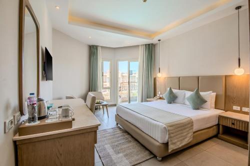 Postel nebo postele na pokoji v ubytování Sunrise Aqua Joy Resort