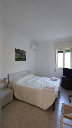 Ένα ή περισσότερα κρεβάτια σε δωμάτιο στο Casa Vacanze Il Giglio di Mare