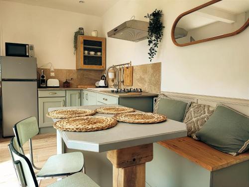 a kitchen with a table with some food on it at La Bastide Girondine in Saint-Loubès