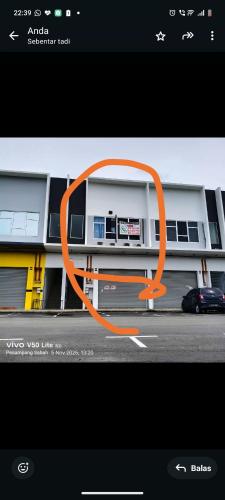 a picture of a building with an orange circle at D-Bayu Motel in Papar