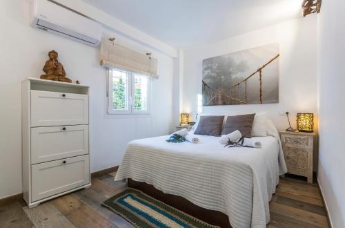 Postel nebo postele na pokoji v ubytování Good times Sevilla