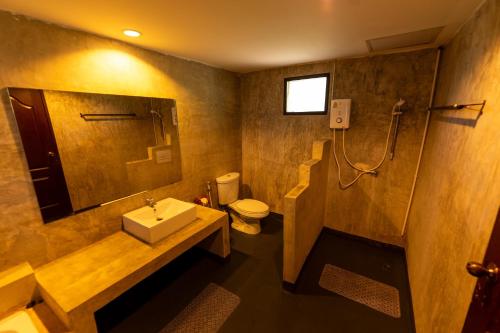 a bathroom with a sink and a toilet and a shower at Khaoyai Nature Life & Tour Resort in Nong Nam Daeng