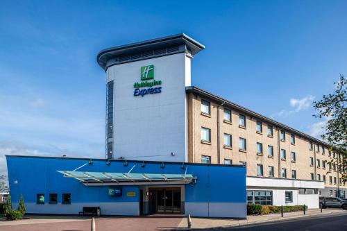 a building with a sign on the side of it at Holiday Inn Express Glasgow Airport by IHG in Paisley