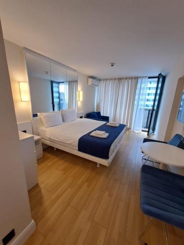 Ένα ή περισσότερα κρεβάτια σε δωμάτιο στο Orbi City - Deluxe