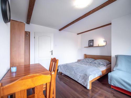 Ένα ή περισσότερα κρεβάτια σε δωμάτιο στο Pokoje Maxi Mare Piamola