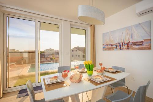 Apartman Oliva and Studio Delux for a family with swiming pool, free parking, terace with view at the sea