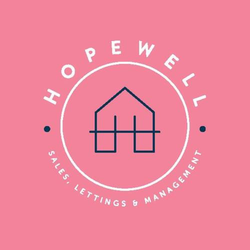 a logo for a real estate company with a house at Studio Flat Close to Queen Square - Flat 2B in Bristol