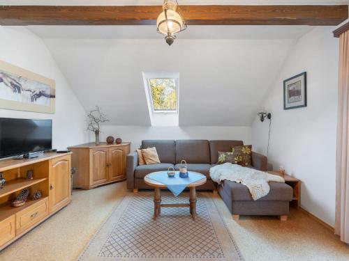 a living room with a couch and a table at Holiday Home Kralovice by Interhome in Nebahovy