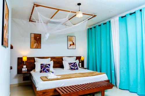 Postel nebo postele na pokoji v ubytování Villa Bako Hôtel