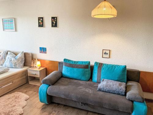 a living room with a couch and a bed at Apartment Hochstein by Interhome in Haidmühle
