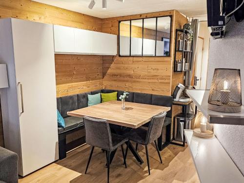 a small kitchen with a table in a tiny house at Apartment Nazca I6 by Interhome in Val Thorens