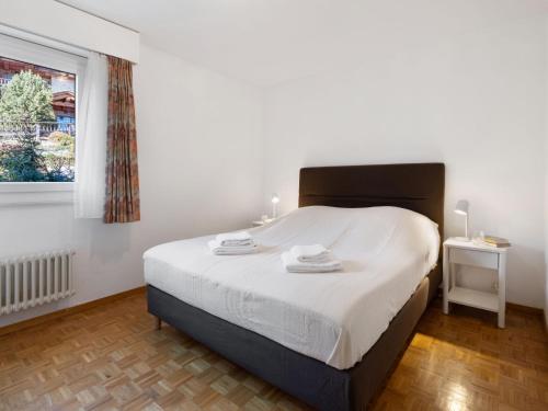 Ένα ή περισσότερα κρεβάτια σε δωμάτιο στο Apartment Marigny Dent-Blanche 25 by Interhome