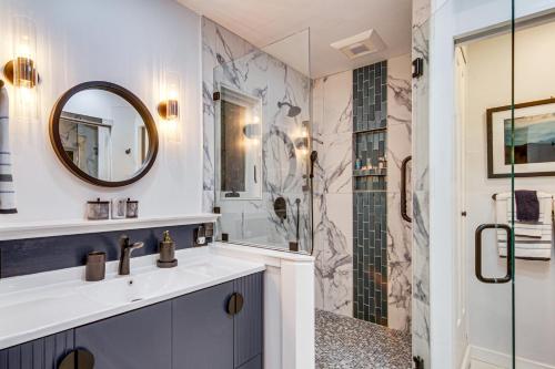 a bathroom with a sink and a shower at Festive Lakefront Escape Blue Ridge Holiday Home in Brevard