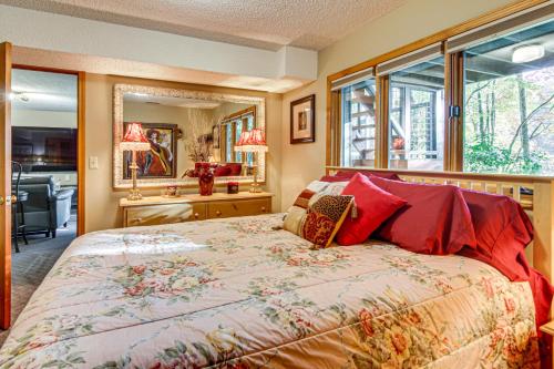 a bedroom with a bed and a large window at Festive Lakefront Escape Blue Ridge Holiday Home in Brevard